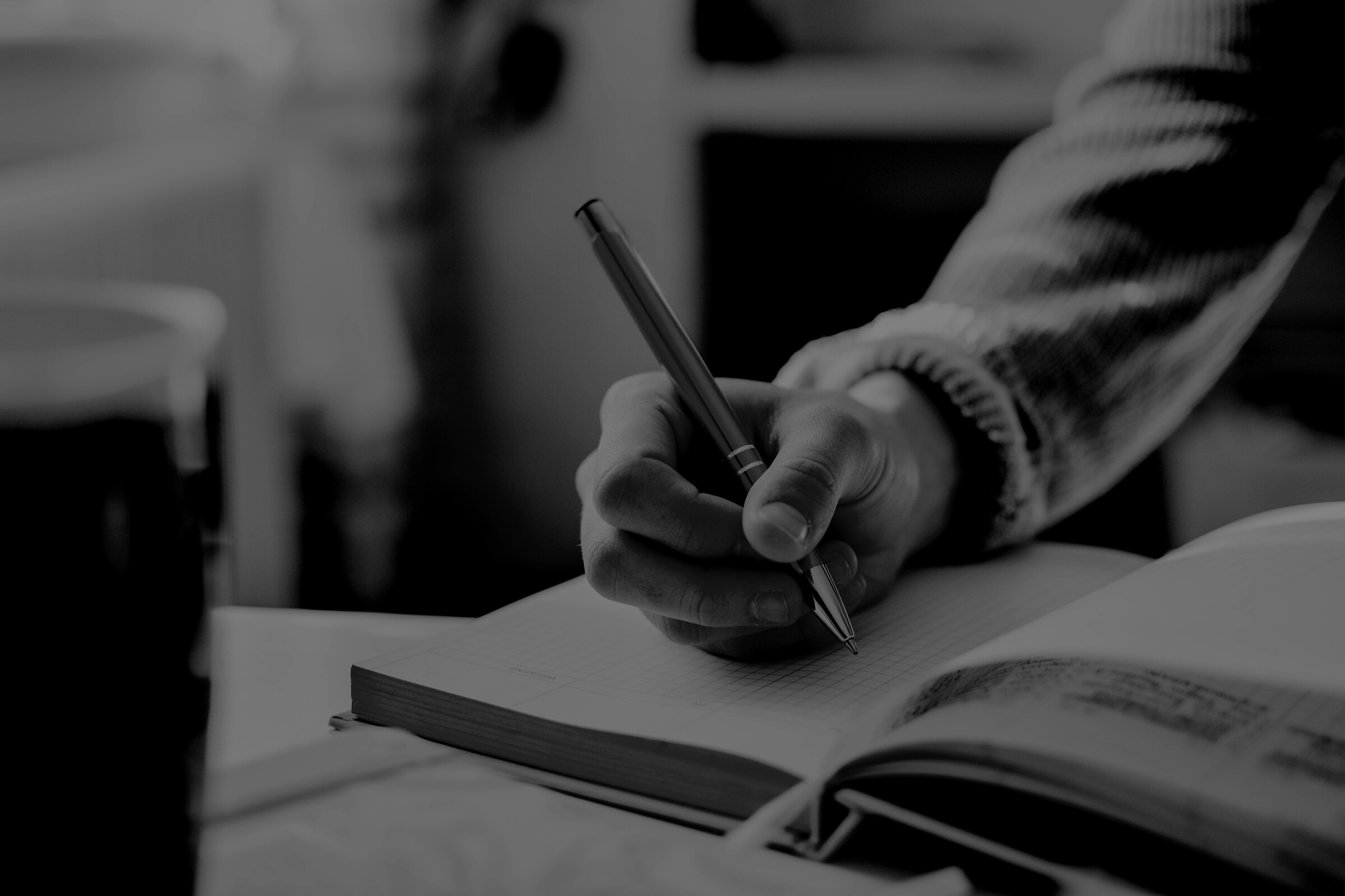 Person Holding Orange Pen